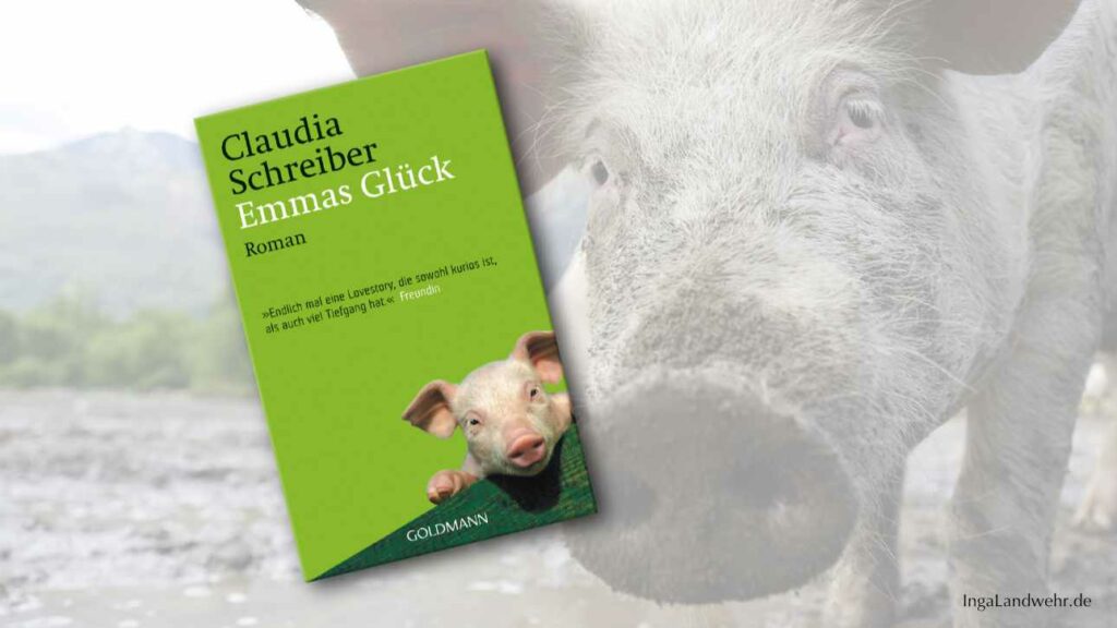 Buchcover von "Emmas Glück" im Vordergrund, Schweineschnauze rechts neben dem Cover